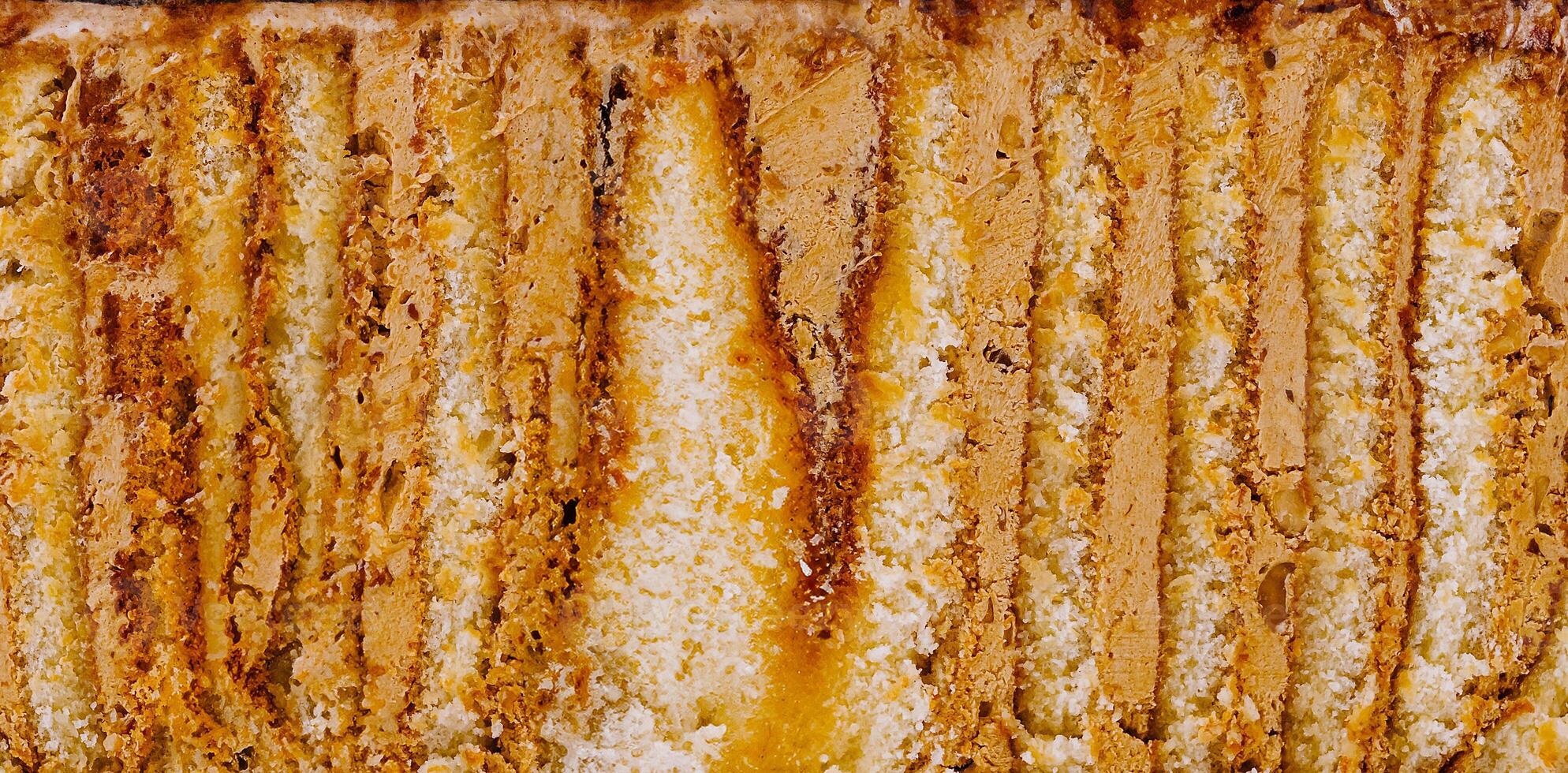 Delicious cake layers forming appetizing food background texture photo