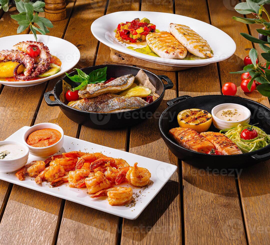 Gourmet seafood mediterranean feast on rustic table photo