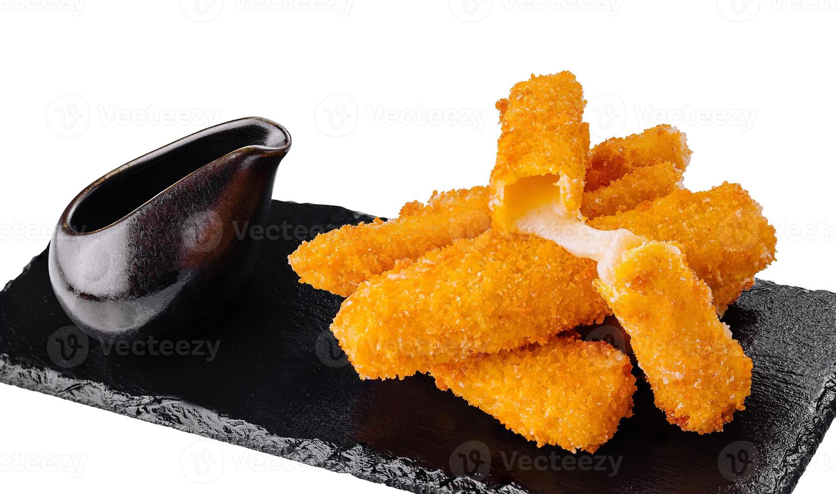 Fried mozzarella cheese sticks with dipping sauce on black stone plate photo