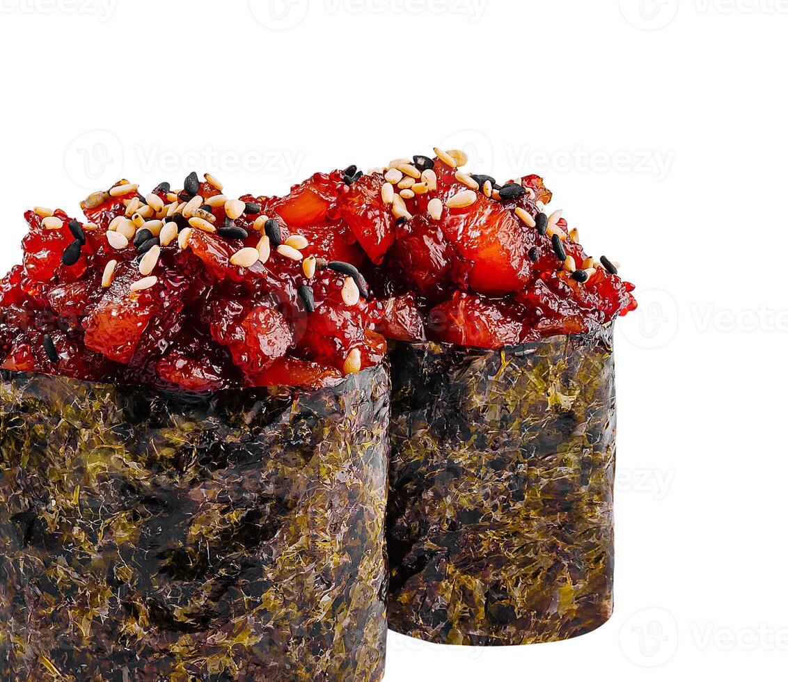 Two gunkan sushi pieces with spicy tuna tartare, sesame and nori seaweed photo