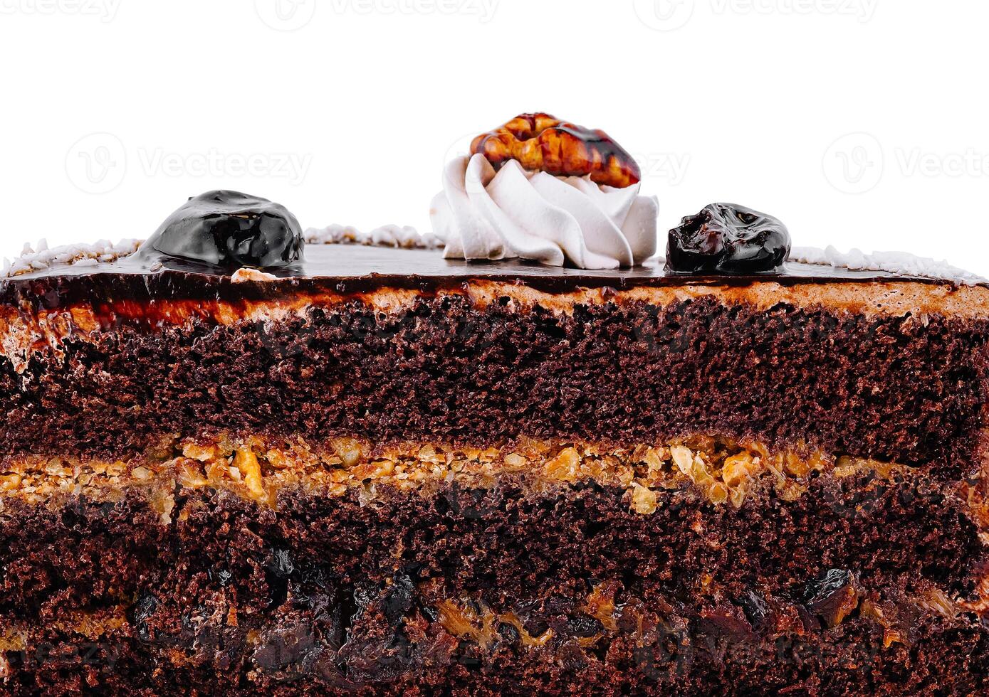 Chocolate cake layers showing filling and toppings close up photo