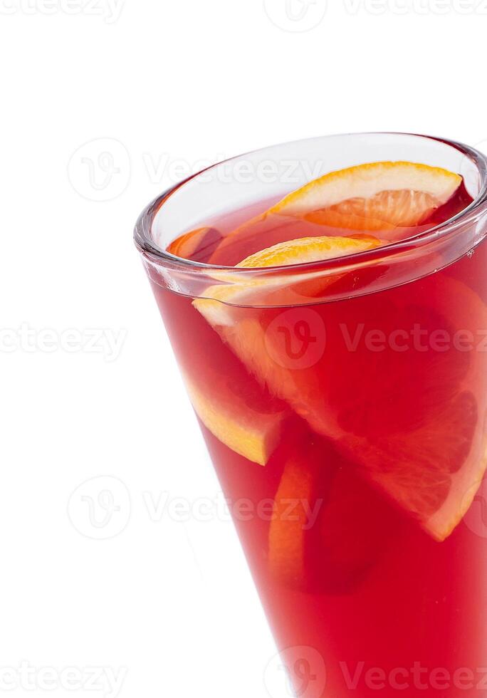 Refreshing red cocktail with orange slices on white background photo