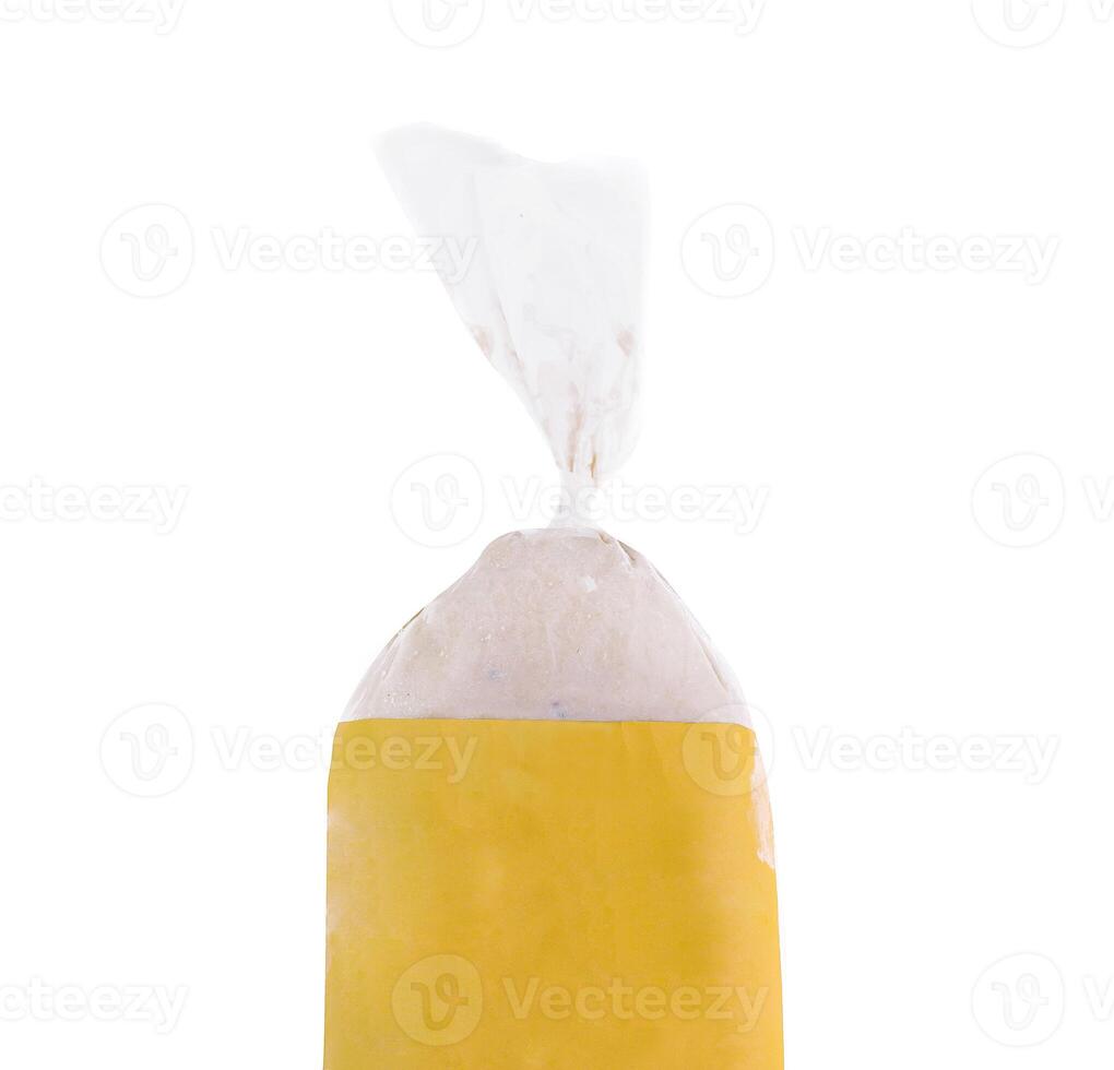 Frozen food bag with yellow label standing up on white background photo