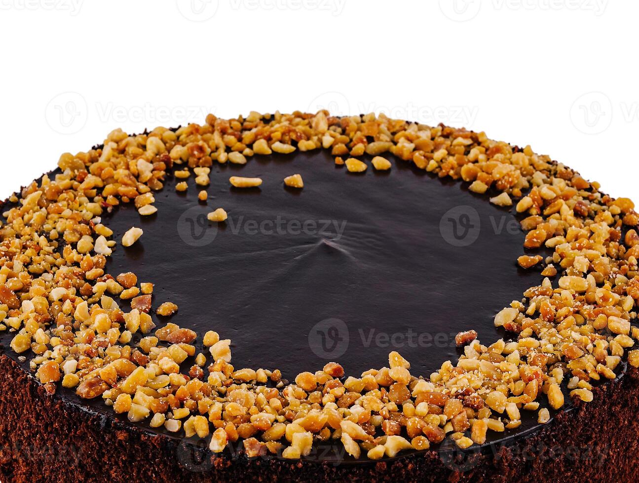 Delicious chocolate cake with chocolate icing and chopped almonds on white background photo