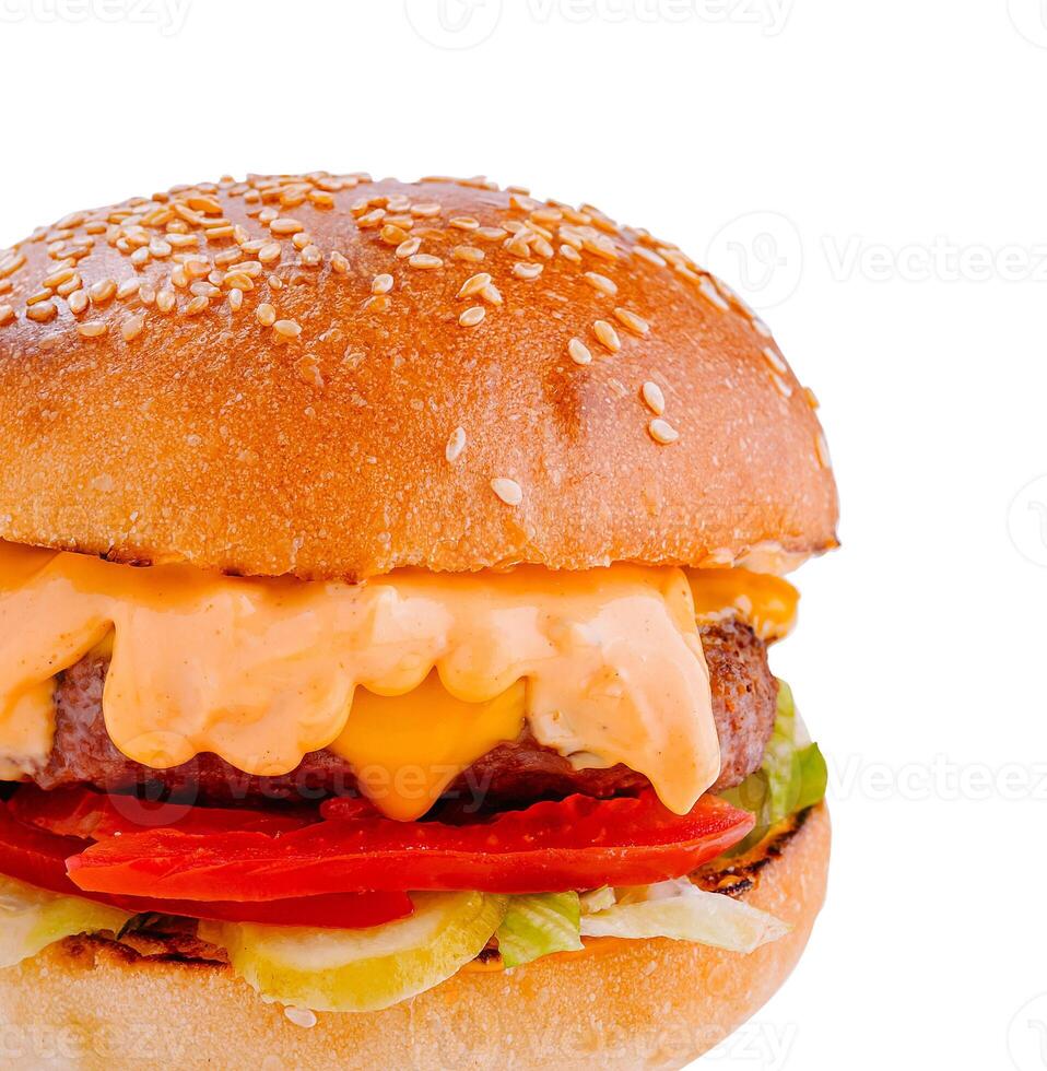 Delicious burger with melted cheese dripping over toppings on white background photo