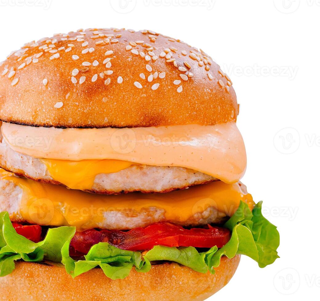 Double burger with lettuce, tomato, cheese and sauce on white background photo