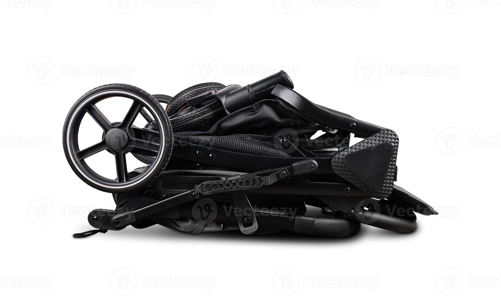 Modern folded black baby stroller isolated on white background photo