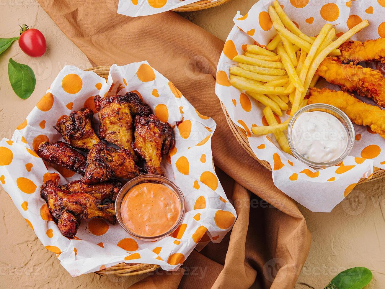 Assorted fast food feast on rustic background photo