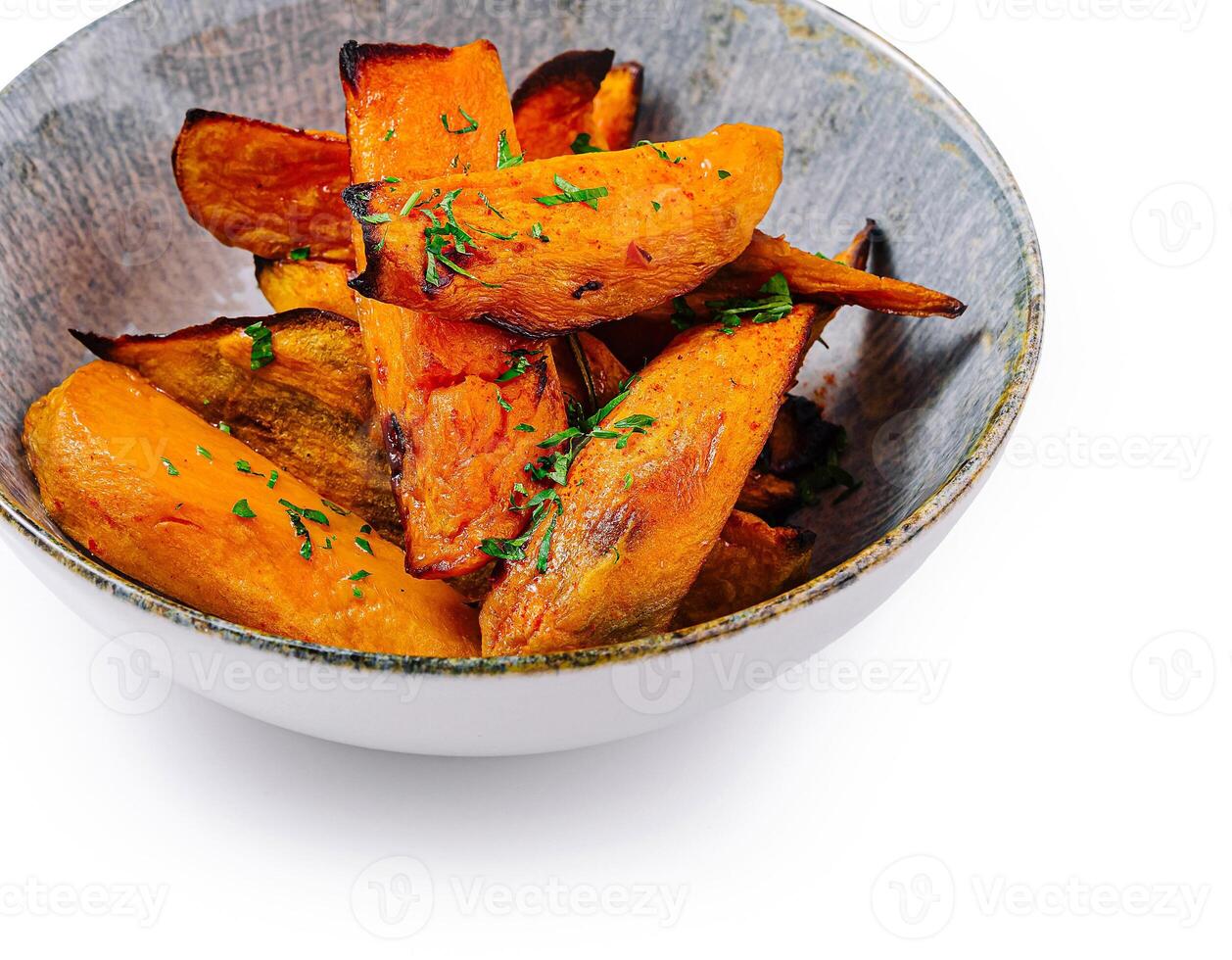 Baked sweet potato fries being served in bowl photo