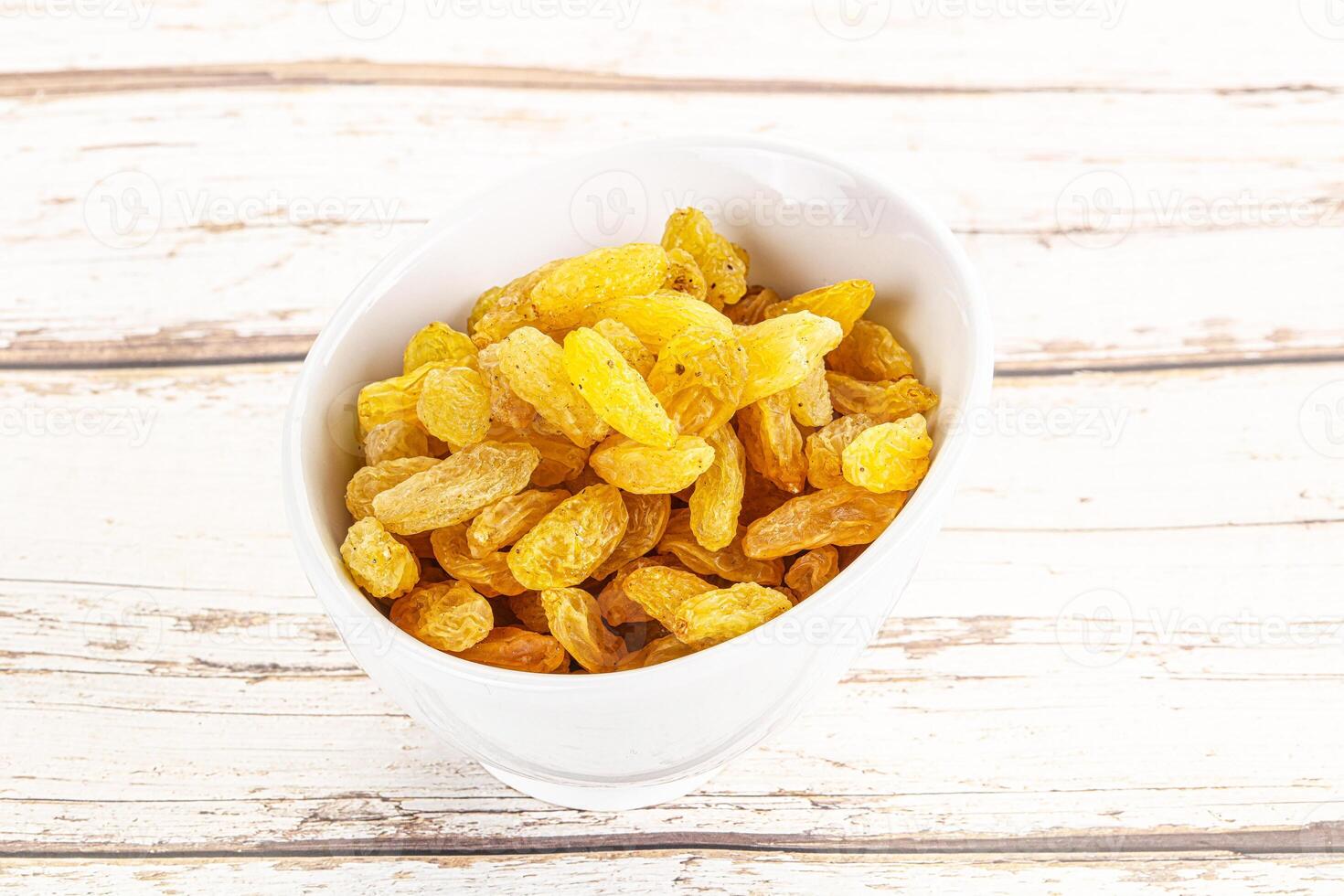 Yellow raisin - dry grape berries photo