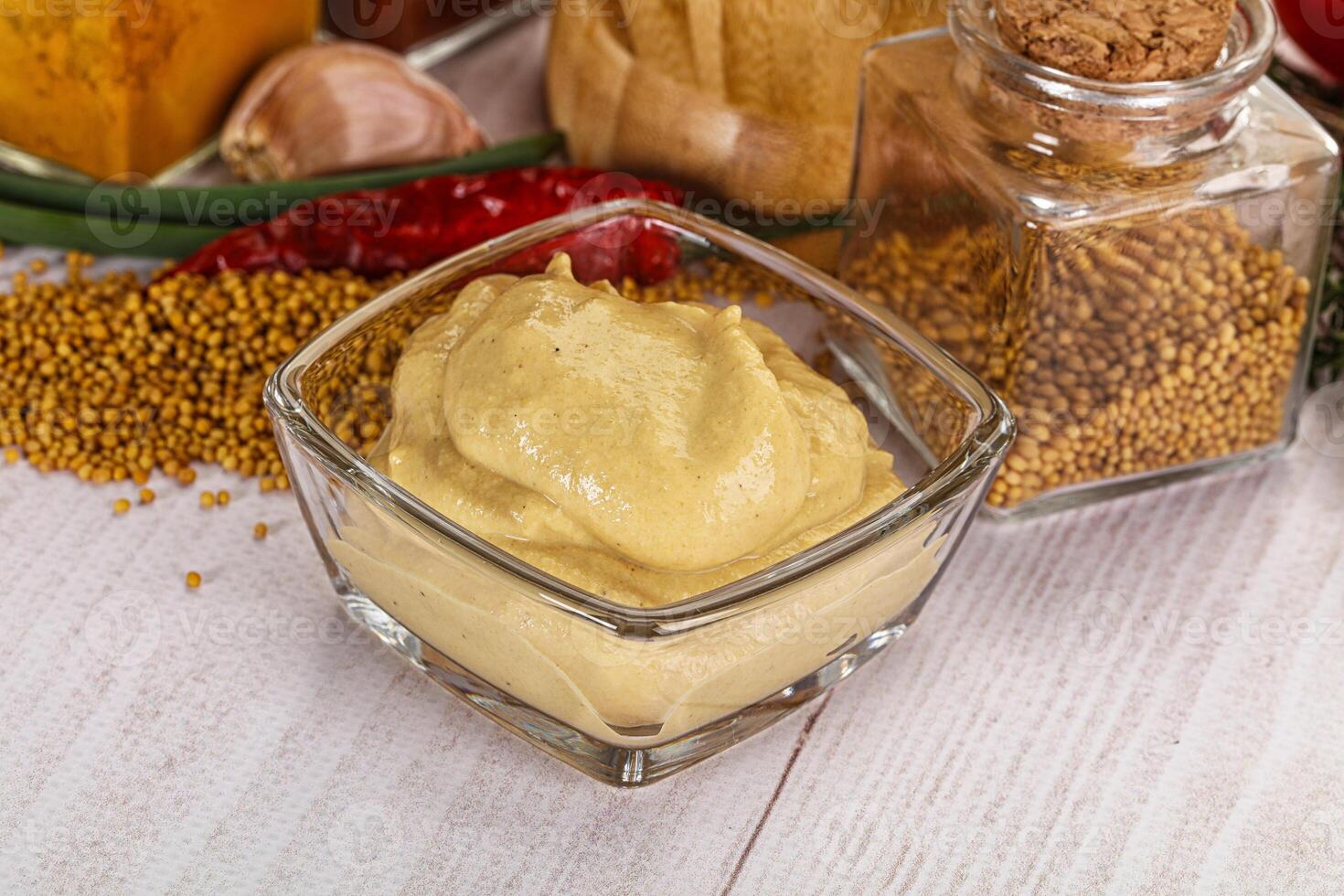 Dijon mustard sauce in the bowl photo