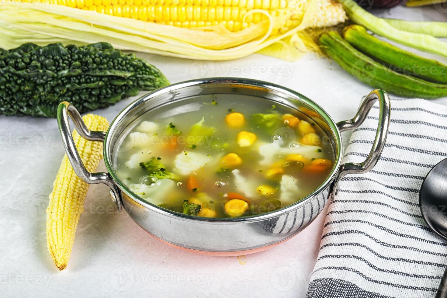 Soup with corn and broccoli photo
