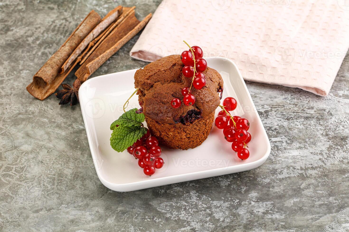 Delicous cupcake with red currant photo