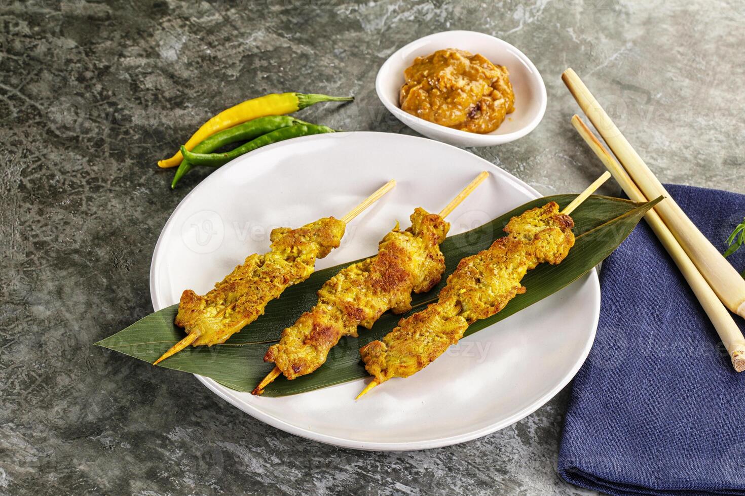 Thai meat skewer Satay with sauce photo