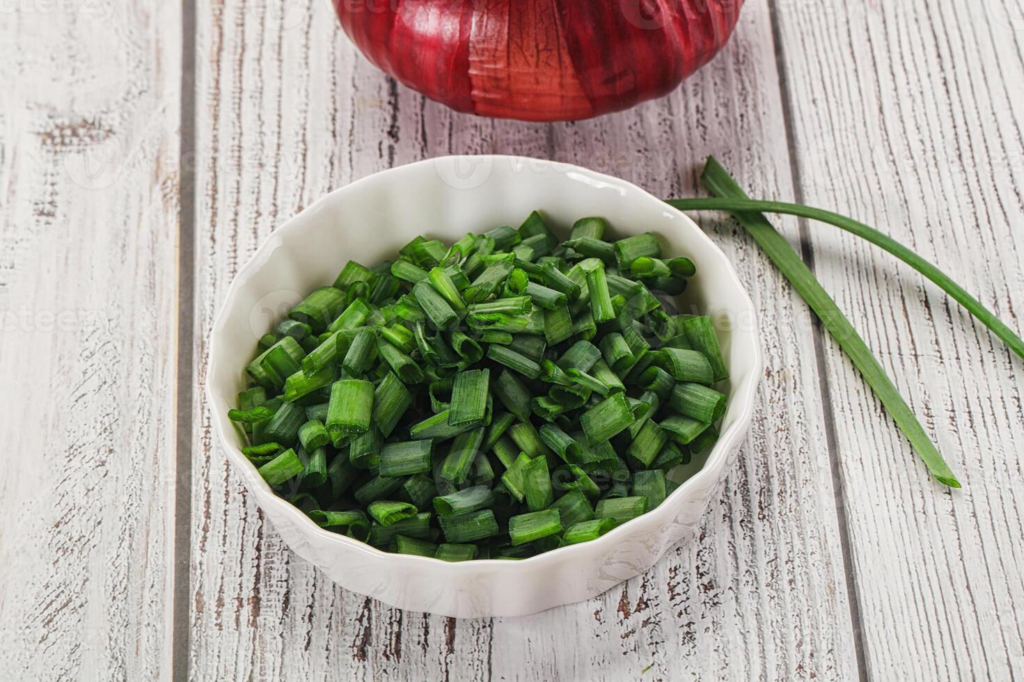 Diced green onion in the bowl photo