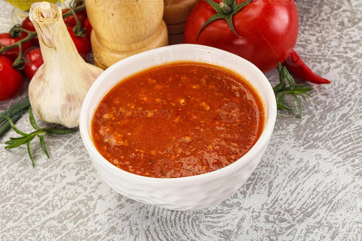 Hot tomato soup with diced chicken photo