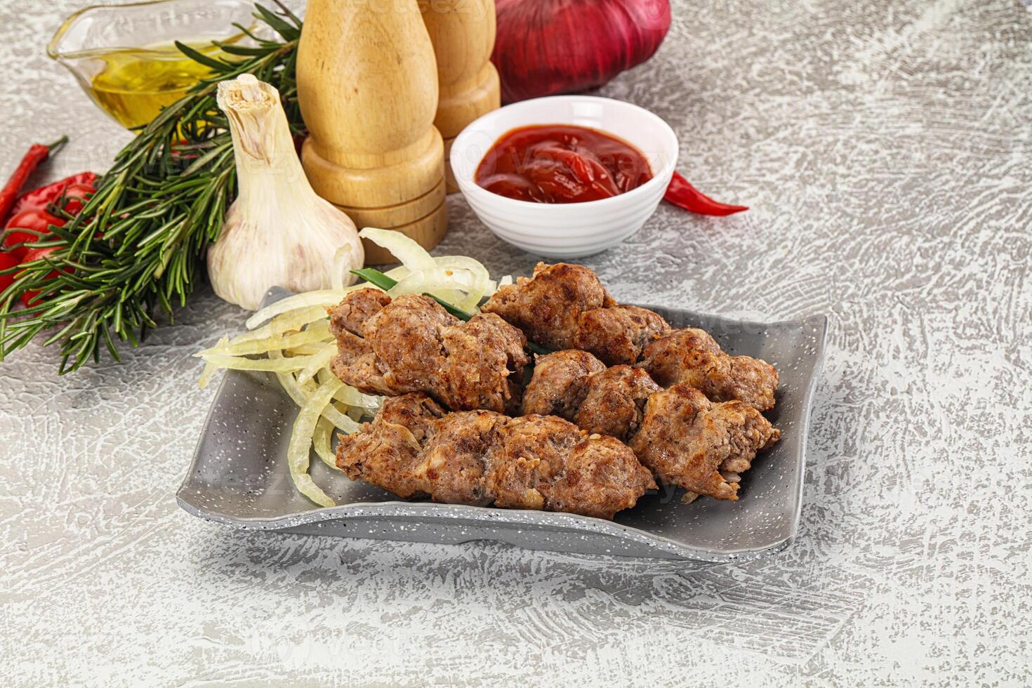 Beef kebab minced meat with onion photo