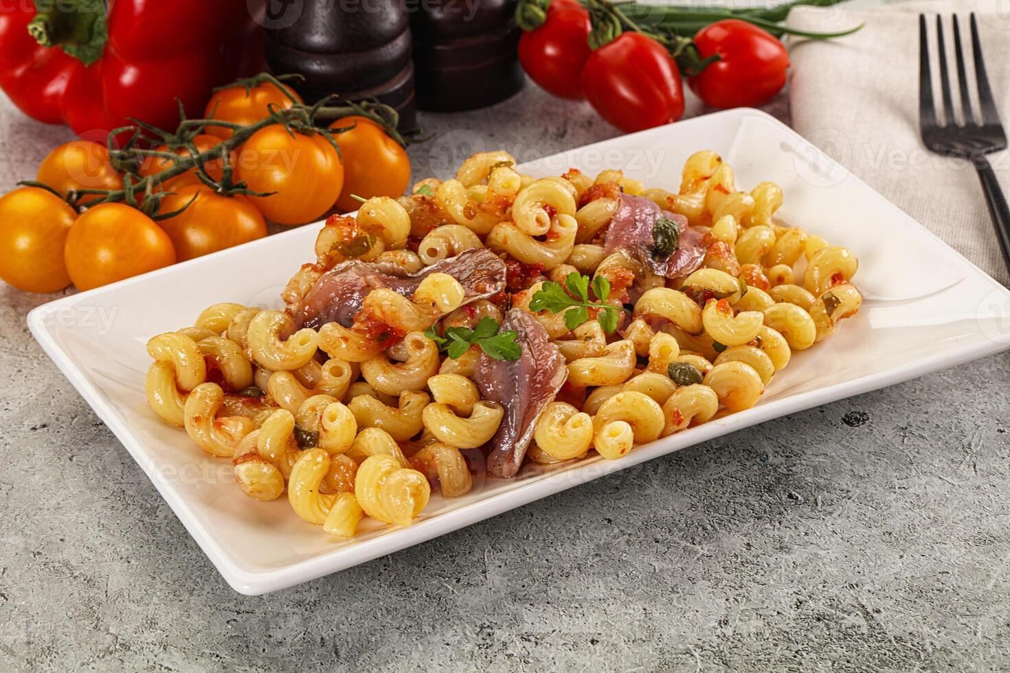 Italian pasta cellentani with anchovy photo