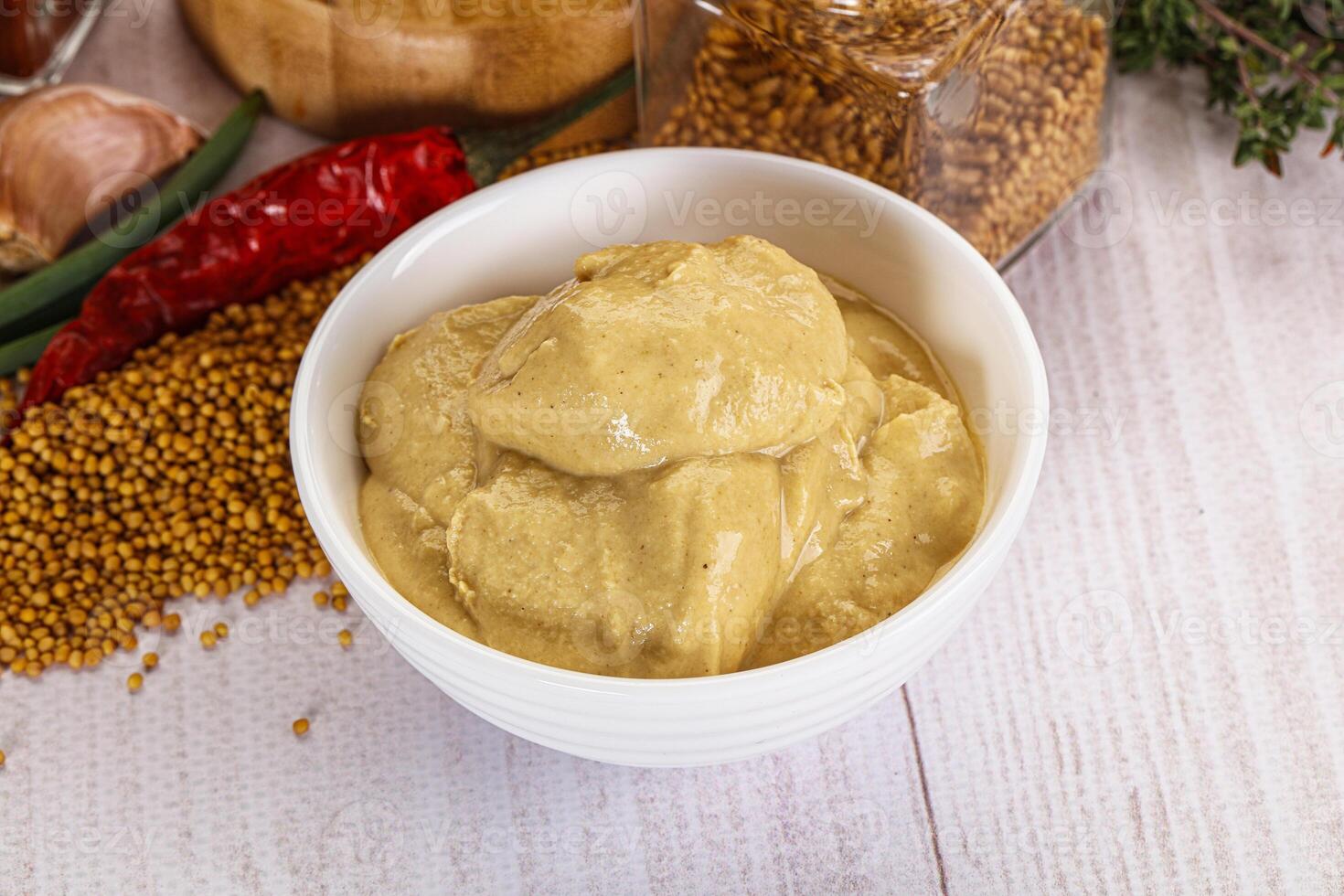 Dijon mustard sauce in the bowl photo