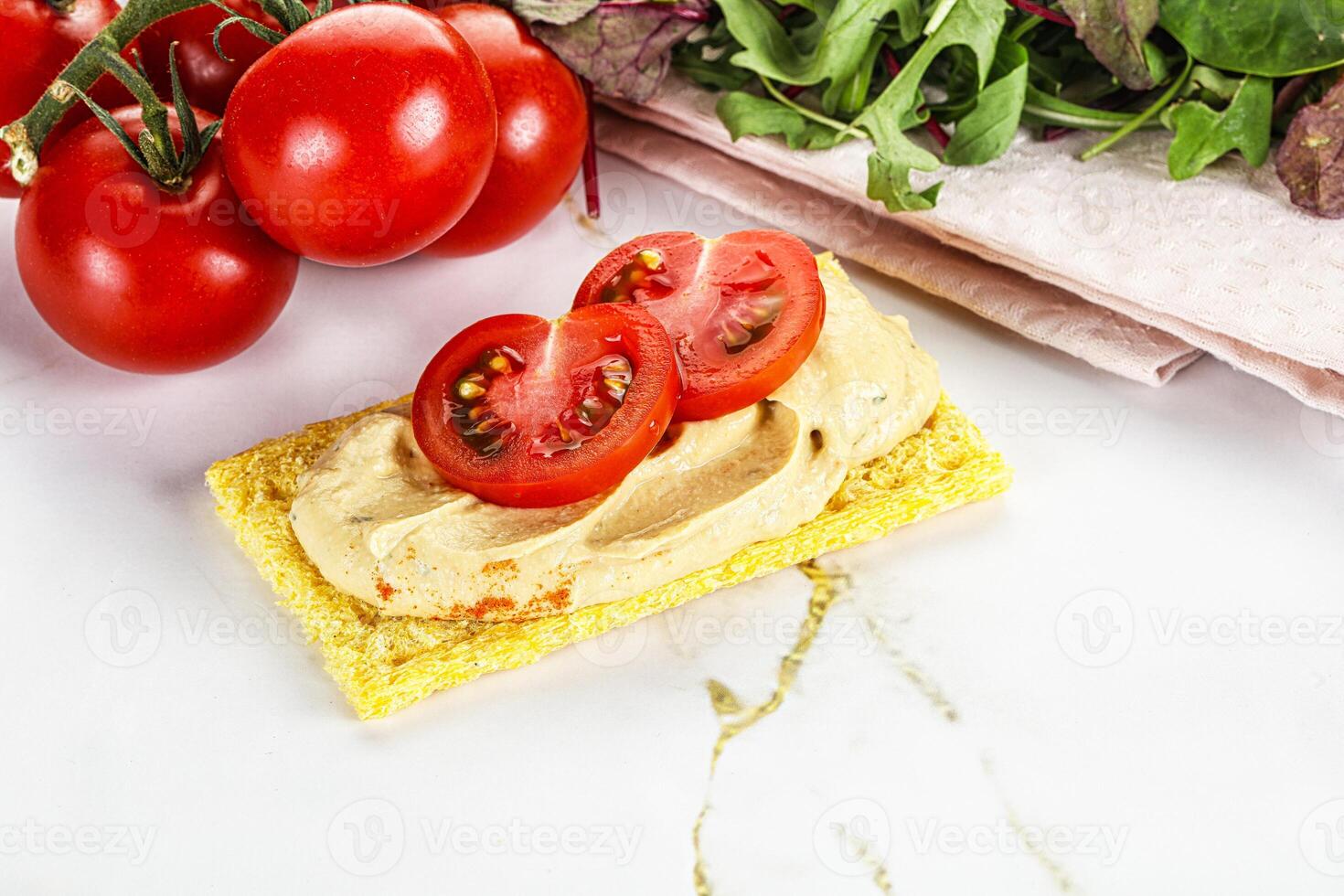 Crispbread with arabic creamy hummus photo