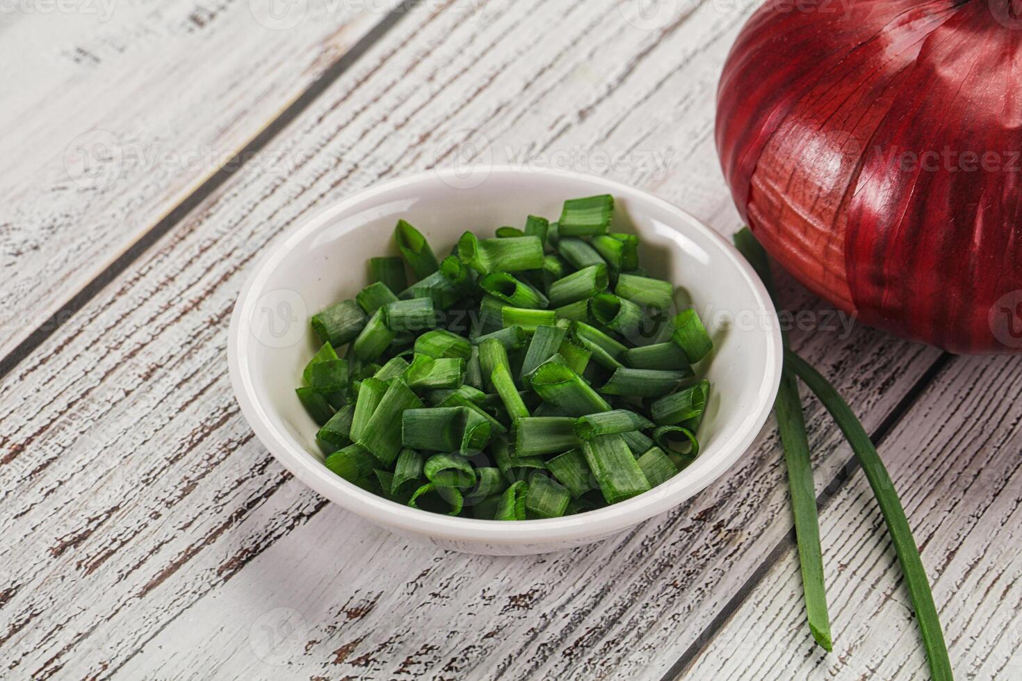 Diced green onion in the bowl photo