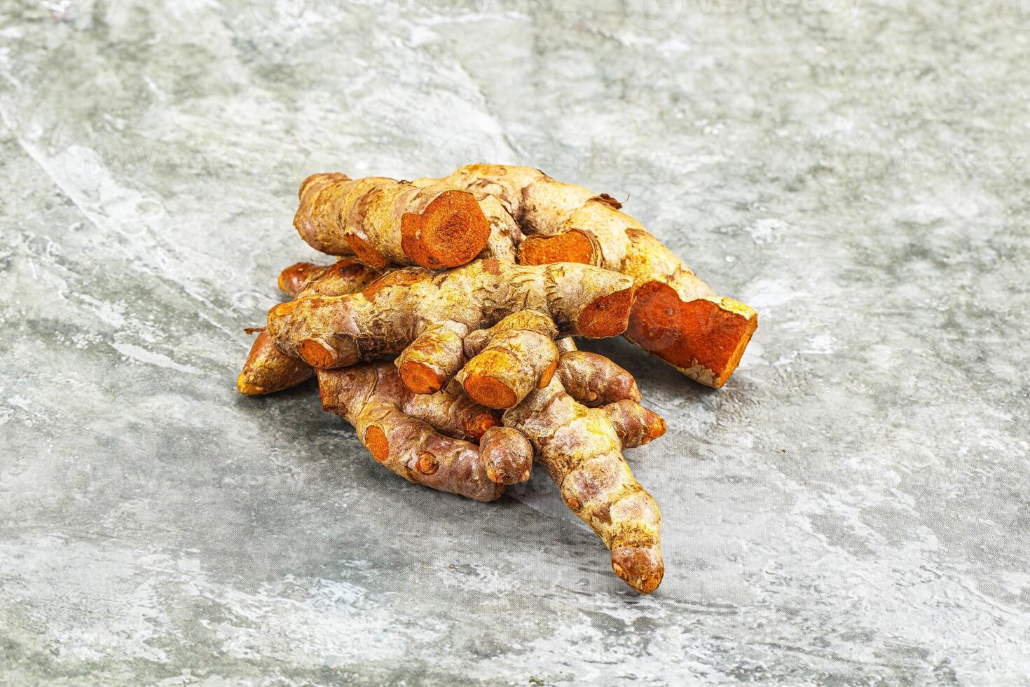 Fresh young Tumeric root heap photo