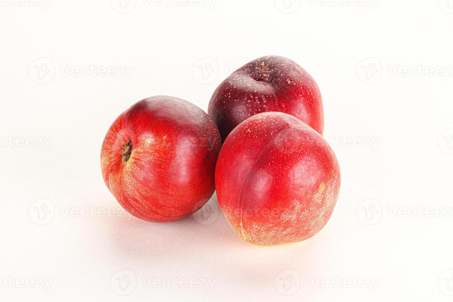 Ripe sweet juicy nectarines heap photo