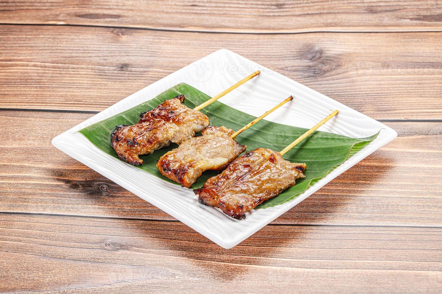 Thai cuisine - grilled pork skewer photo