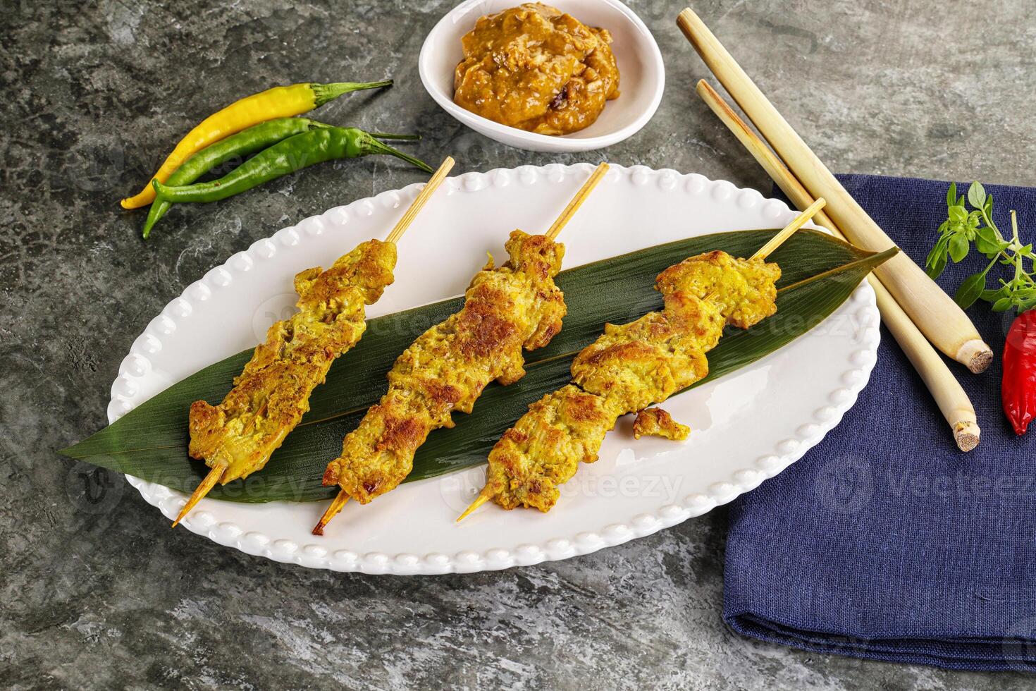Thai meat skewer Satay with sauce photo