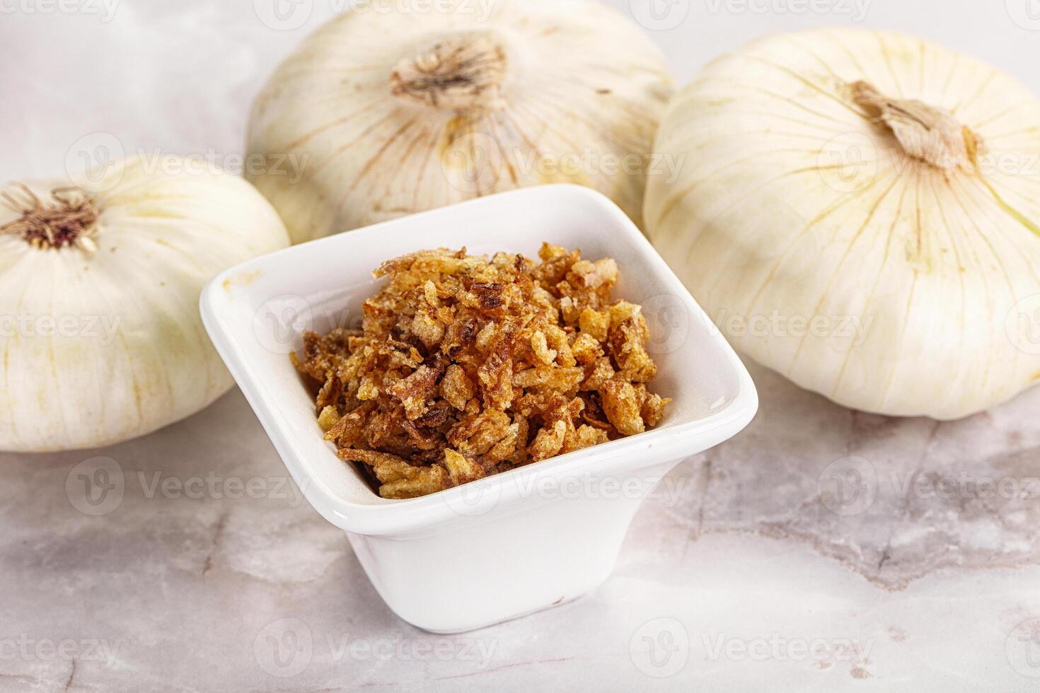Dried roasted onion flakes for culinary photo