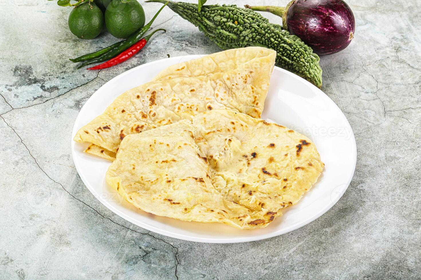 Indian tandori bread - naan with cheese photo
