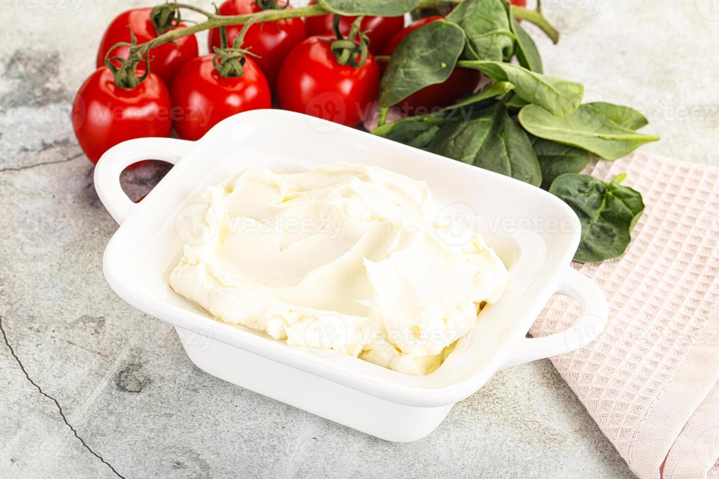 Soft cream cheese in the bowl photo