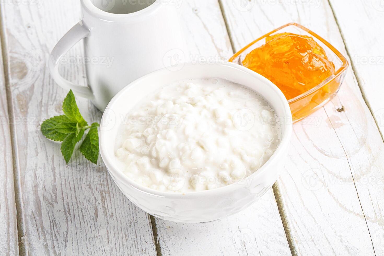 Grain curd with cream and jam photo