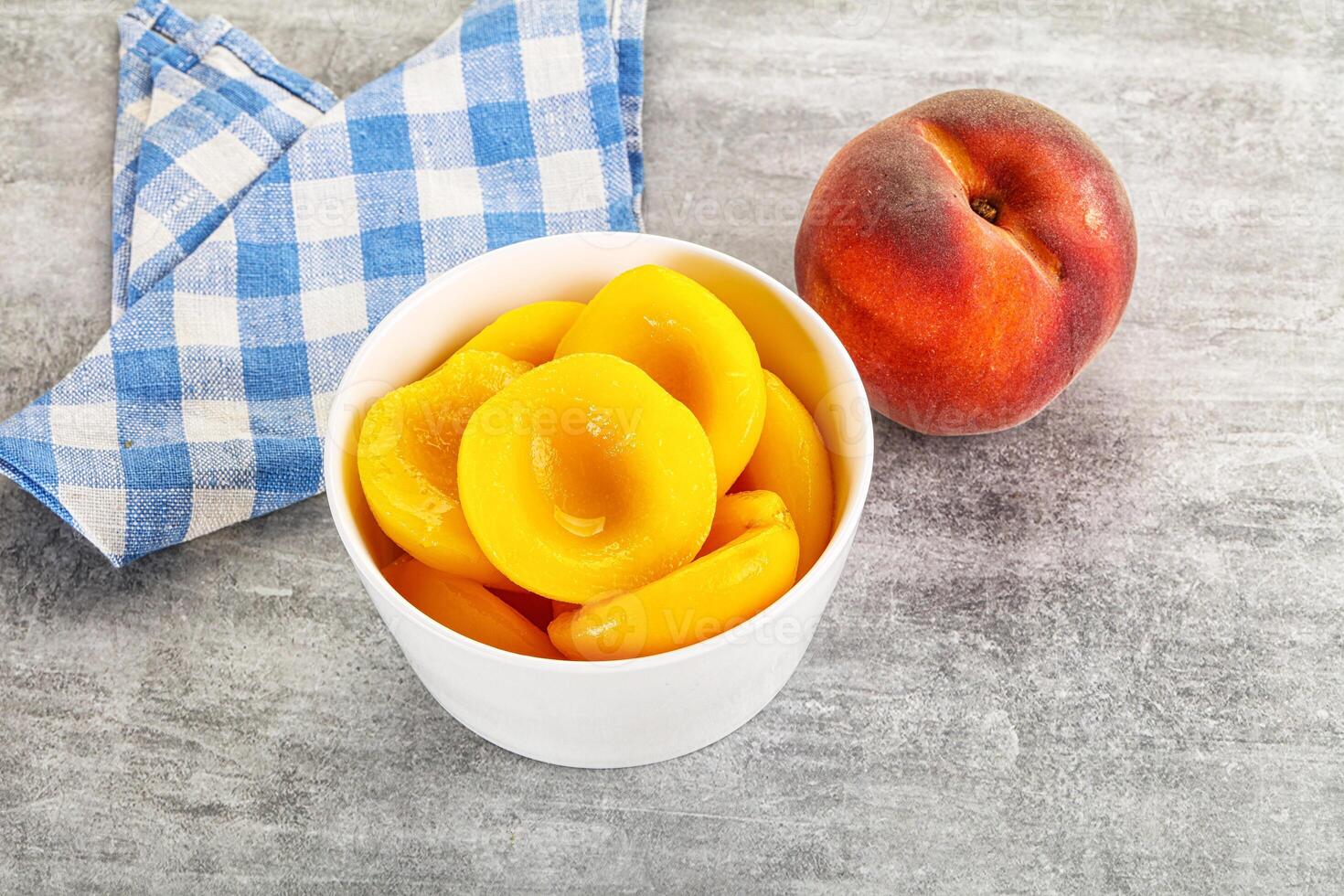Ripe sweet and juicy canned peach photo