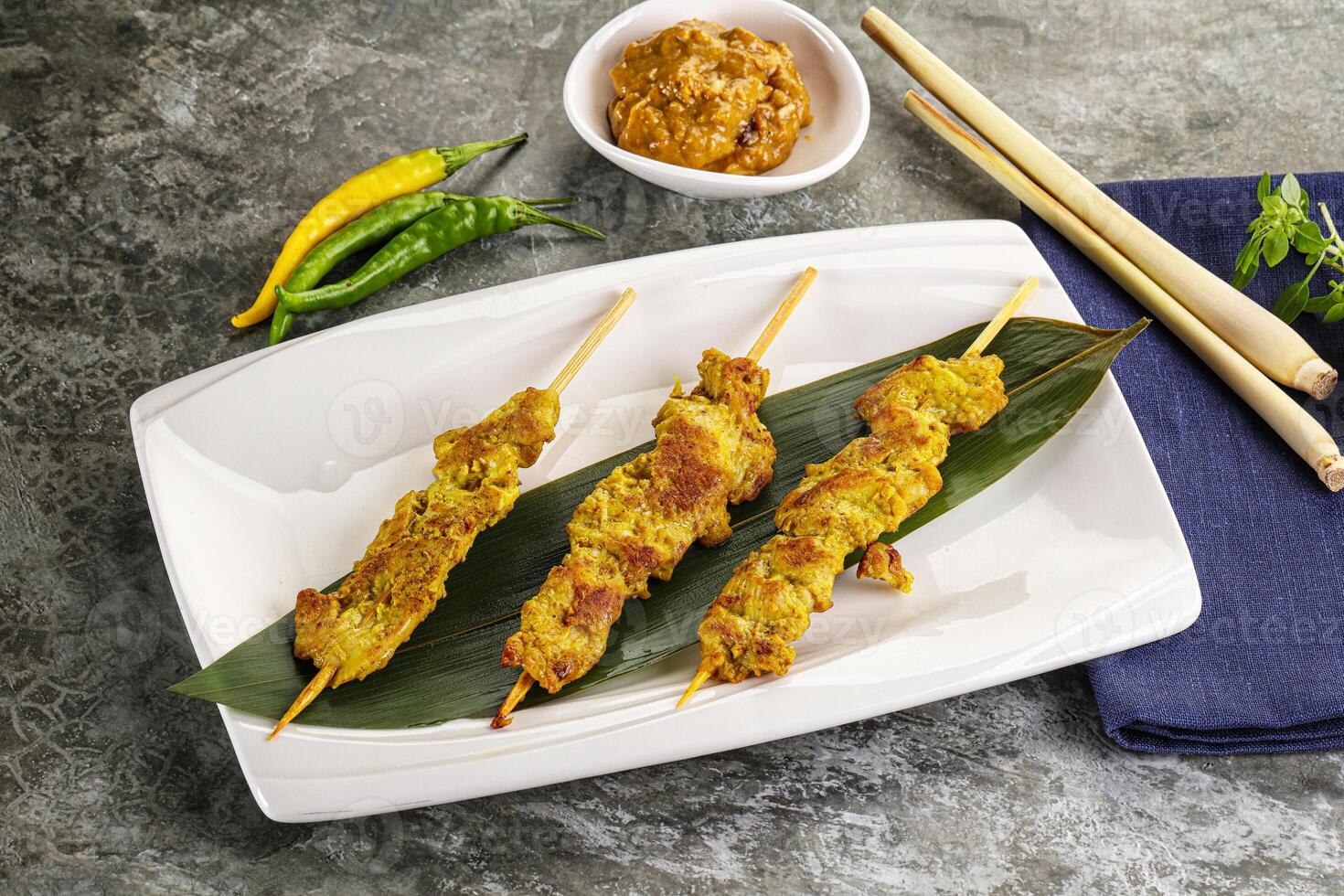 Thai meat skewer Satay with sauce photo