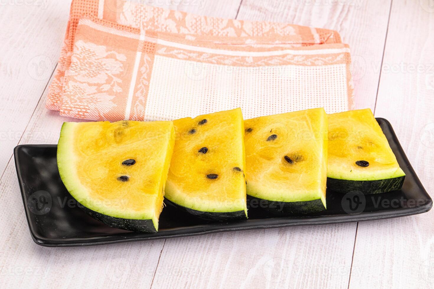Sweet and juicy yellow watermelon slices photo