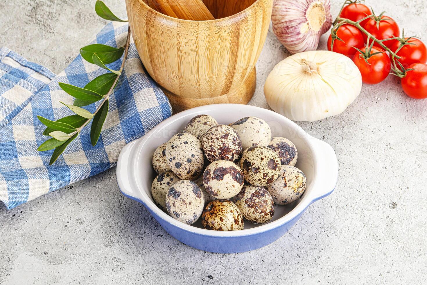 Raw quail eggs in the bowl photo