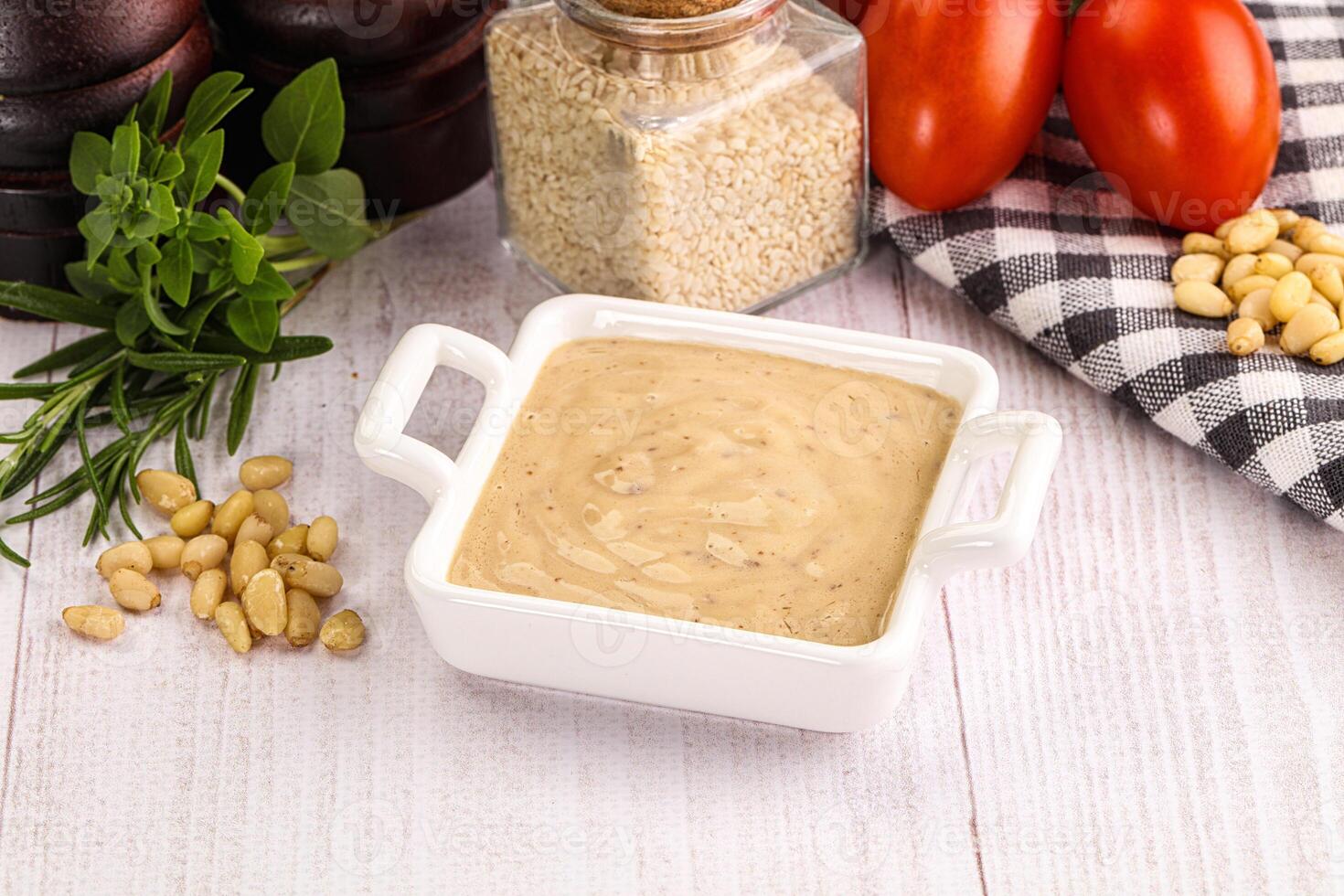 Delicious walnut creamy sauce in the bowl photo