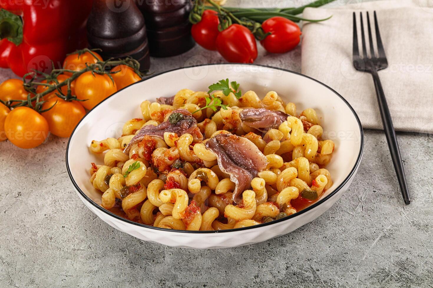 Italian pasta cellentani with anchovy photo
