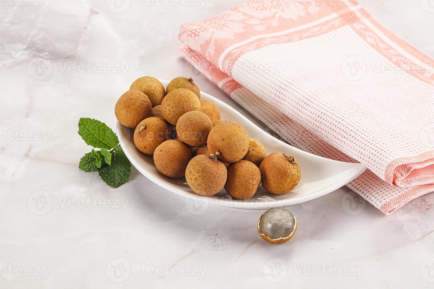Tropical delicous fruit Longan heap photo