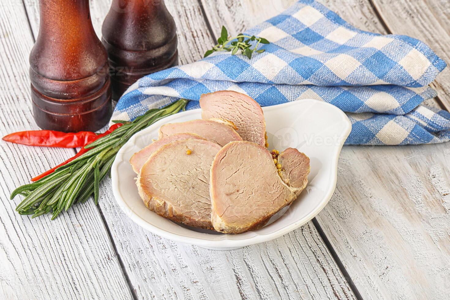 Baked pork tenderloin served rosemary photo