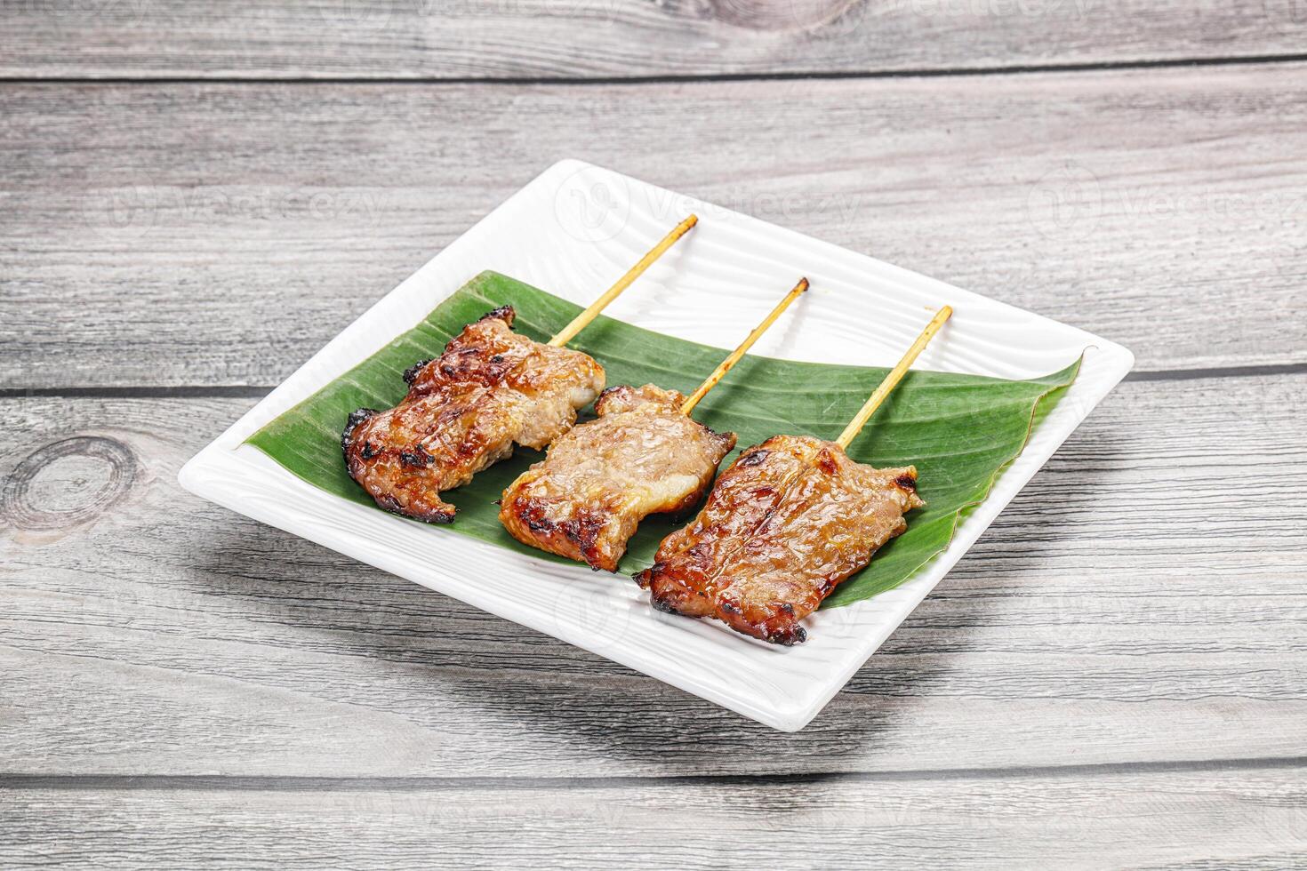 Thai cuisine - grilled pork skewer photo