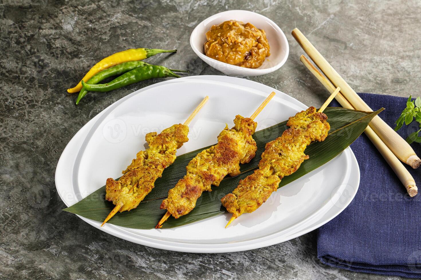 Thai meat skewer Satay with sauce photo