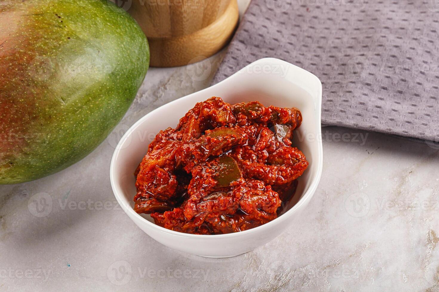 Spicy pickled raw green mango photo