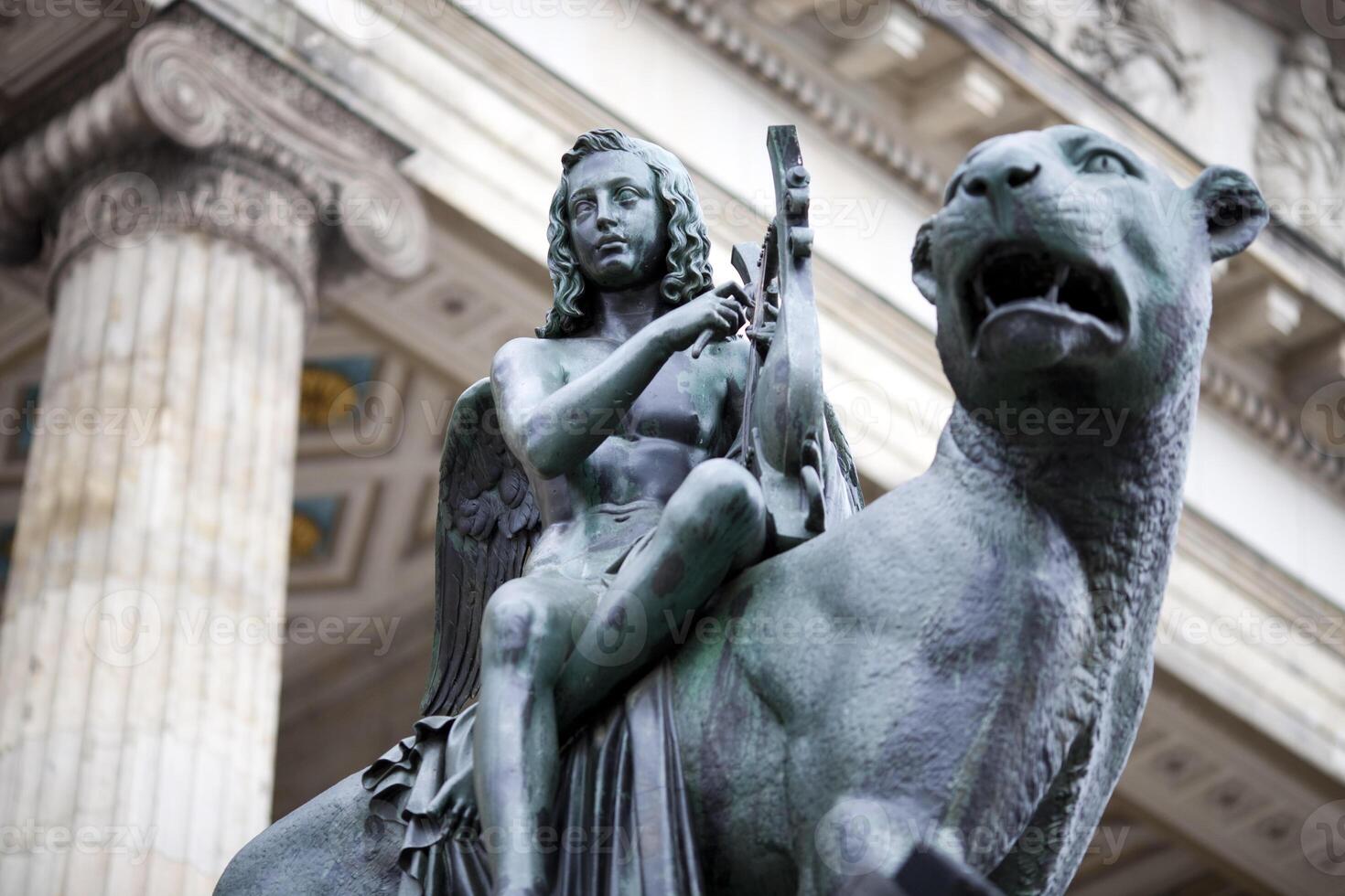 Bronze Statue of a Winged Figure and Lion at the Konzerthaus in Berlin photo