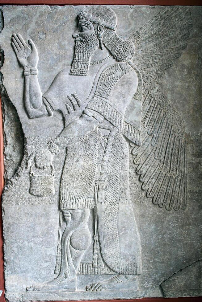 Berlin, Germany, July 24 2009, Assyrian Alabaster Relief of Winged Beings, Pergamon Museum photo