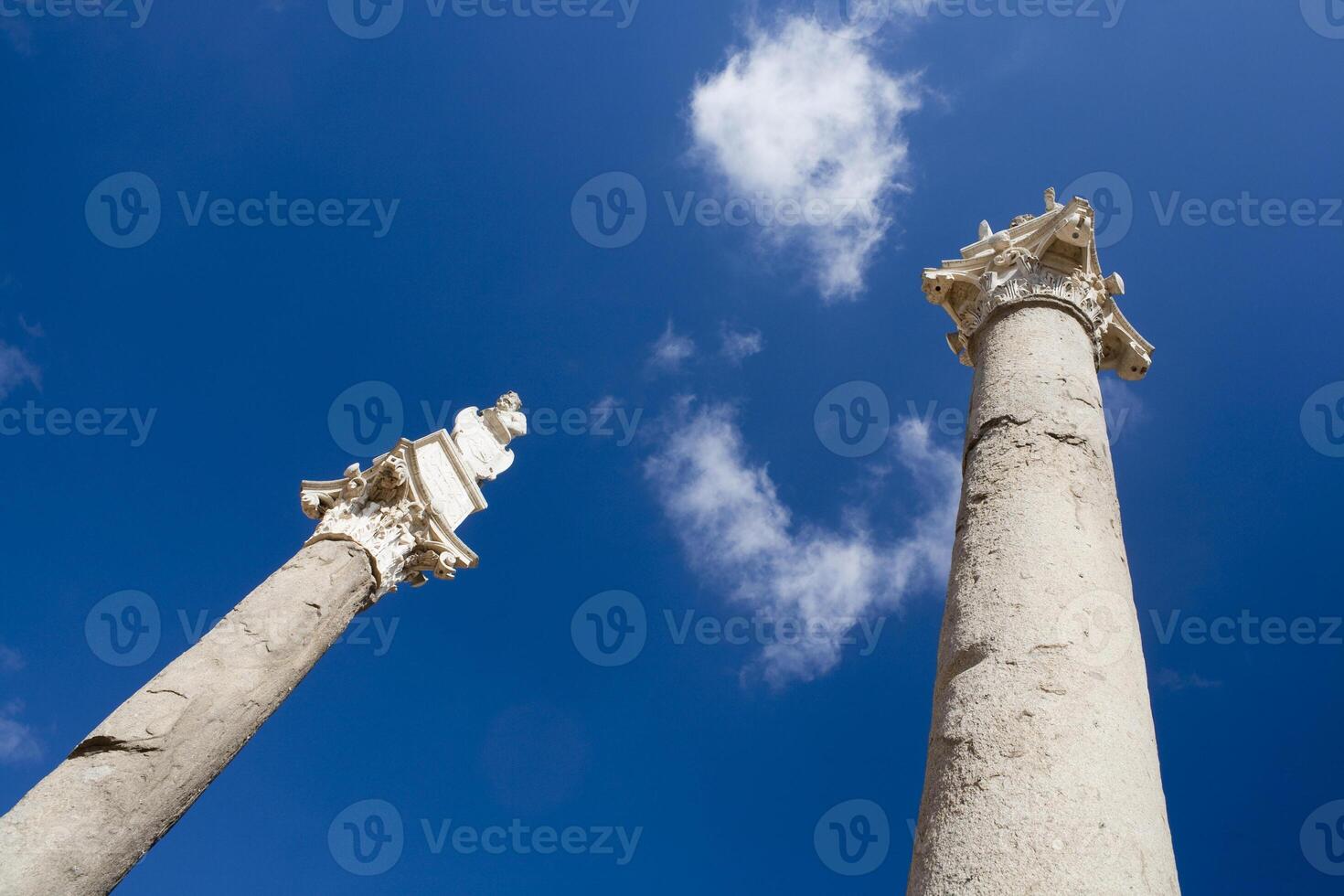Roman Columns at the Alameda De Hercules Under a Blue Sky in Seville photo