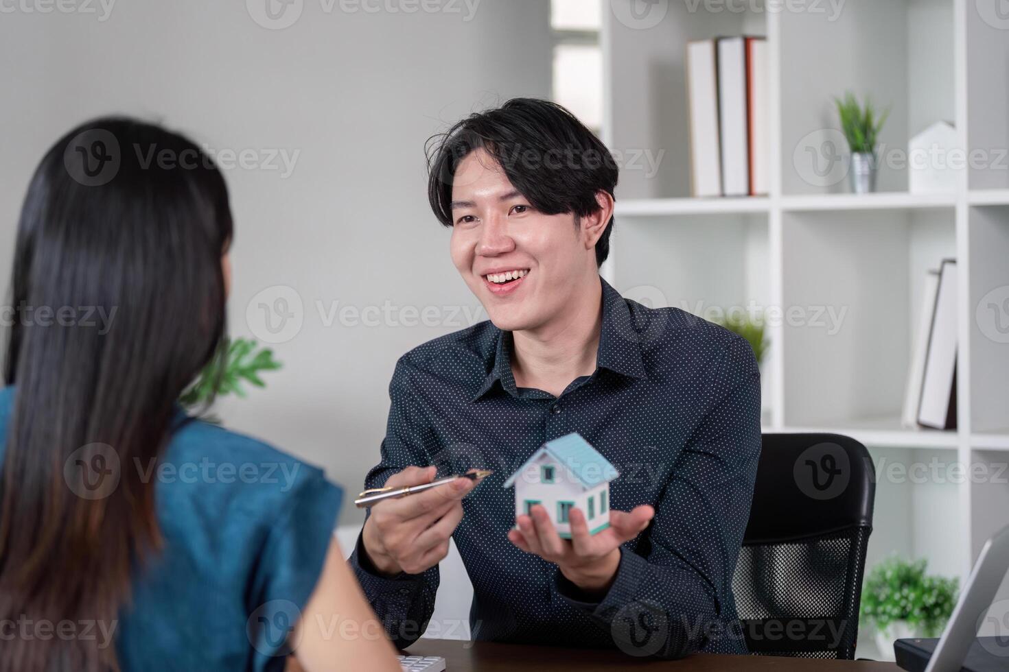 Real Estate Agent Explaining Home Ownership Opportunities photo