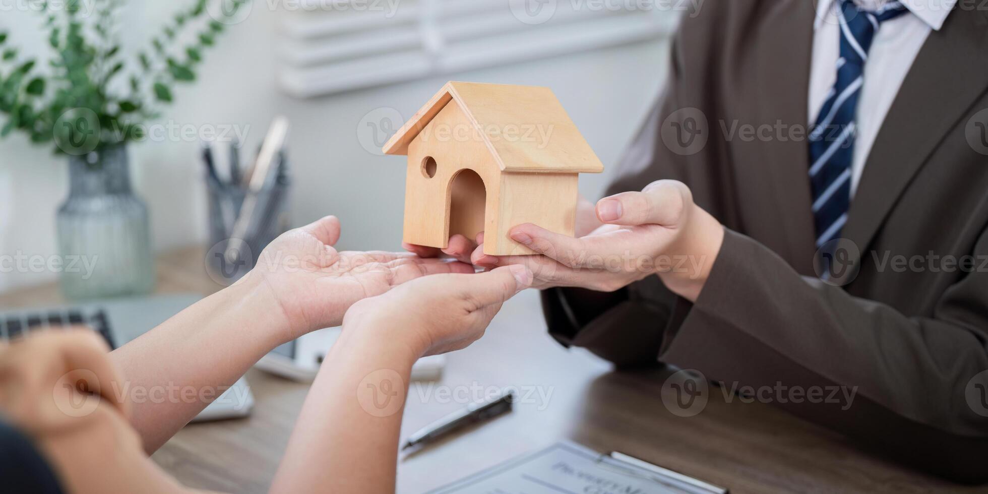 Real Estate Agent Guiding Client Through Home Transfer Process for Seamless Property Acquisition photo