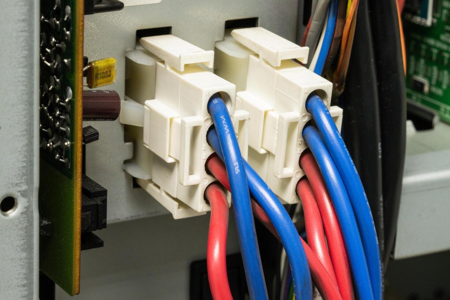 A cables Wire-to-Wire Connector System, featuring various colors like red and blue with signal and power carrying capabilities photo